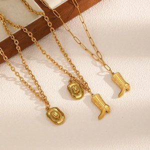 Gold stainless steel necklaces featuring western cowboy boot and hat charms on a paperclip chain