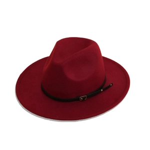 Detailed texture of burgundy wool fedora hat with black leather strap and metal buckle
