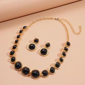 Vintage gold and black resin geometric jewelry set with necklace and stud earrings