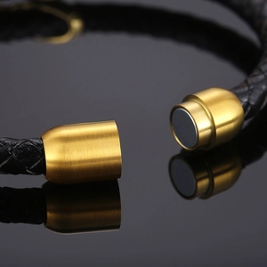 Braided leather bracelet with gold magnetic clasp and sparkling infinity symbol accent