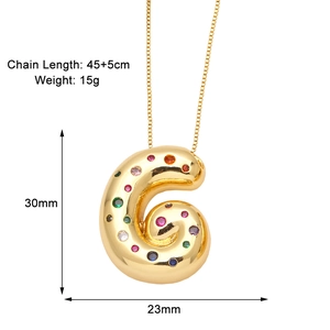 Detail view of gold letter G pendant necklace with dimensions 30x23mm and chain specs
