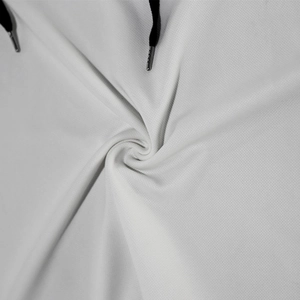 Detailed macro view of white hooded tank top fabric with black drawstrings and metal tips