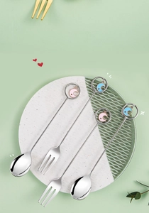 Close-up of star and moon pendants on 304 stainless steel dessert spoons and forks