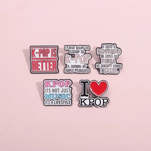 Set of 5 K-Pop themed metal enamel pins featuring colorful letters on pink background