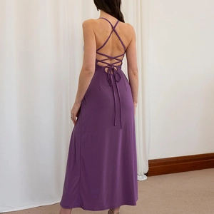 Detail view of the backless tie-up design on this purple evening dress with crisscross straps