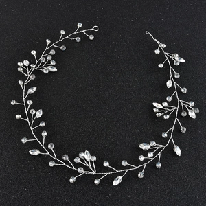 Macro detail of silver bridal headband featuring marquise crystals and woven wire