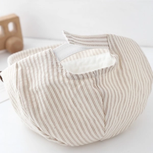 Beige striped baby captain hat with adjustable velcro strap and soft quilted lining