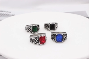 Retro Viking rings with four-color gemstones and Celtic knot patterns on a display tray