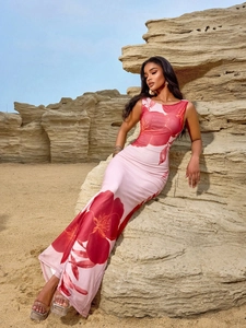Detail of floral print maxi dress on model in desert rocks for vacation look