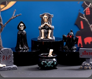 Detailed view of Halloween resin ornaments featuring skeletons and spooky ghost figurines