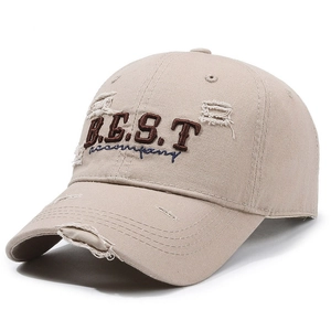 Distressed beige baseball cap with B.E.S.T embroidery shown from a 45-degree angle