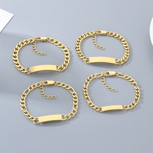Macro view of four engravable gold titanium steel Cuban chain ID bracelets for men
