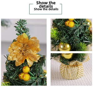 Detailed view of mini Christmas tree with gold flowers and glittery ornaments for table