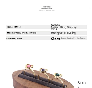 Detail view of walnut wood ring display with gray velvet slots and dimension specs