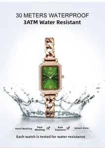 Macro view of water splashing on a green square watch with rose gold strap