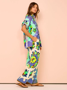 Detail of tropical lemon print two-piece set with satin texture wide-leg pants