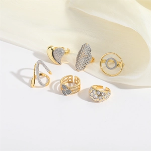 Exotic abstract heart and circular gold rings with silver crystal accents set