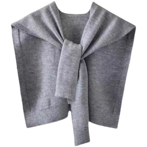 Detail of light grey core spun yarn knitted shawl with elegant front tie knot design