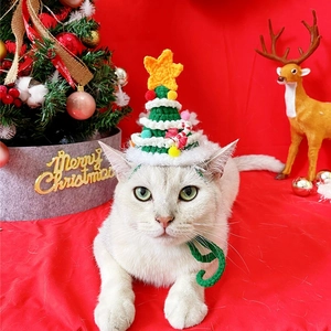 Cute knitted Christmas tree hat for cats with yellow star and white pom-pom detail
