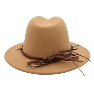 Detail of camel wool fedora hat featuring ethnic style beaded brown decorative ropes