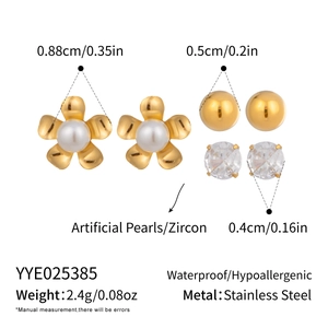 Detailed view of stainless steel earring set with pearls, zircons and gold floral studs