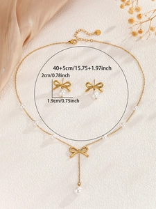 Detailed view of stainless steel bow jewelry set with elegant pearls and dimensions
