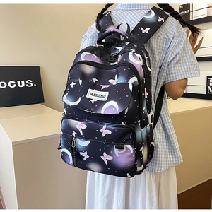Detail view of large capacity backpack with moon star and butterfly prints