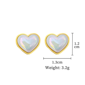 Detailed view of titanium steel heart studs with size dimensions and weight in grams