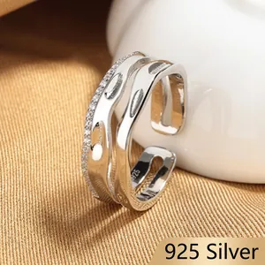 Detailed macro shot of an adjustable S925 silver multi-layer ring with pavé stones