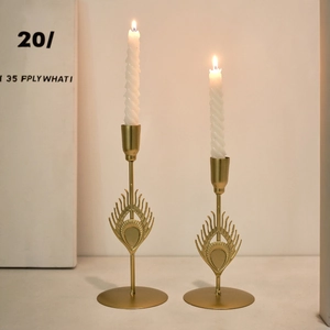 Set of 2 vintage gold peacock feather metal candlesticks with spiral white candles