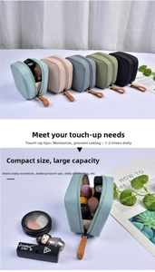 Detail view of five different colors and interior capacity of a compact nylon makeup bag