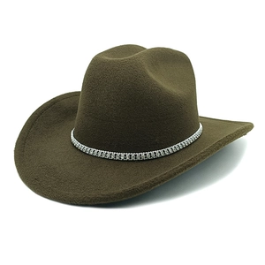 Detail of dark brown wool cowboy hat featuring a wide brim and sparkling rhinestone band