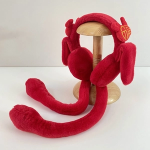 Red plush Christmas earmuffs with reindeer antlers and Fu character gold embroidery