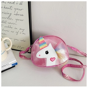 Detail of pink satin unicorn crossbody bag with glitter horn and rainbow mesh wings