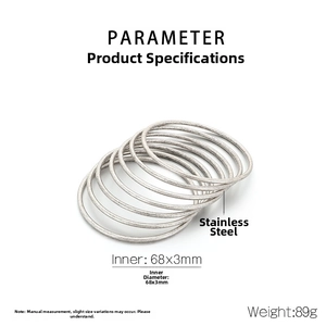 Detailed view of stacked stainless steel bangles with 68x3mm inner diameter specs