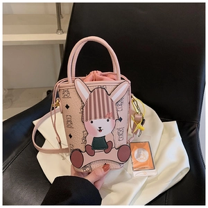 Detail of pink mini bucket bag with cartoon bunny decor and bear pattern print