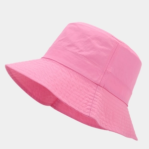 Detail of pink waterproof sun hat featuring quick-dry textured fabric and reinforced stitching