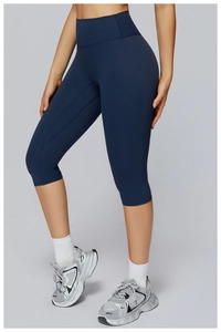 Detail of high-waist matte navy yoga shorts with ergonomic seams and elastic fabric