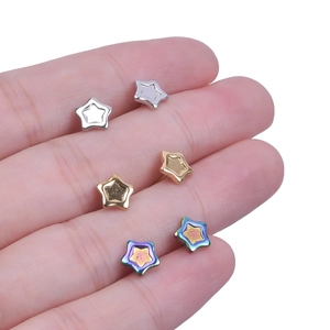 Detailed view of 304 stainless steel star earrings in silver, gold, and iridescent finishes