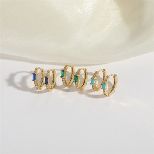 Elegant gold earrings with sparkling zircon stones and rectangular colorful gems