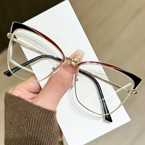 Cat-eye metal glasses frame in gold and black, stylish eyewear for face contouring