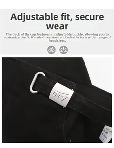 Detail of black cotton baseball cap showing adjustable silver metal buckle and strap