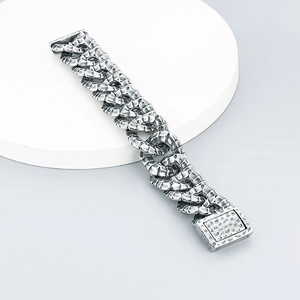 Detailed close-up of vintage stainless steel snake scale link bracelet with a square clasp