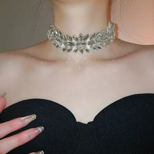 Close-up of elegant silver flower choker necklace with sparkling waterdrop crystals