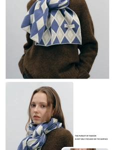 Detail of blue and white argyle knit scarf with original design label and soft texture