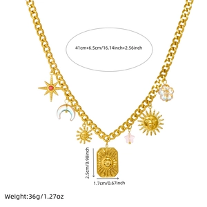 Gold chunky chain necklace with moon, star, and sun face charms on a white background