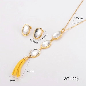 Gold stainless steel jewelry set with glass stone pendants and yellow tassel details