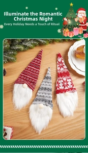 Three Christmas gnomes featuring knitted hats and faux fur beards on a wooden table