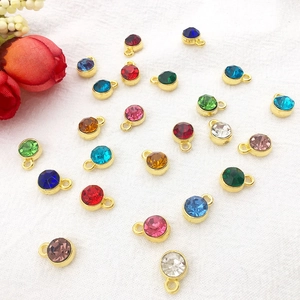 Close-up of 7mm colorful alloy birthstone charms with gold plating for DIY jewelry