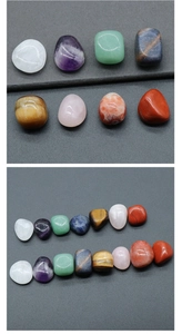 Close-up of seven polished natural chakra crystal stones for yoga and meditation healing